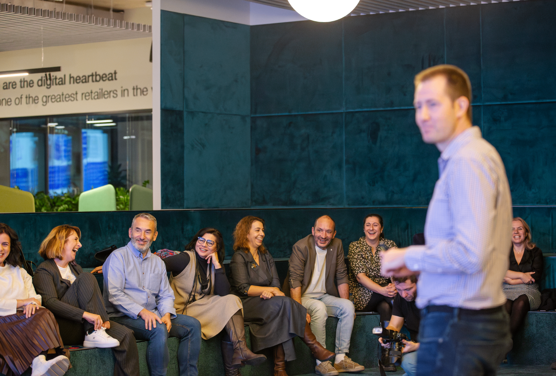 Engaged audience laughing during a PM training session