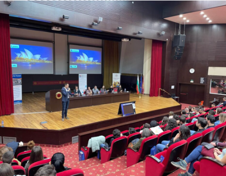 University lecture to a large auditorium of students